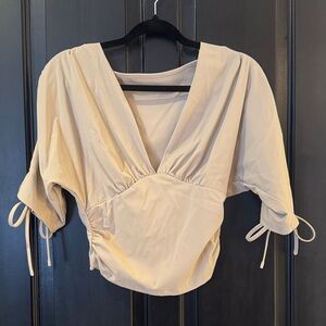 Elegant Cream V-Neck Blouse with Tie Details